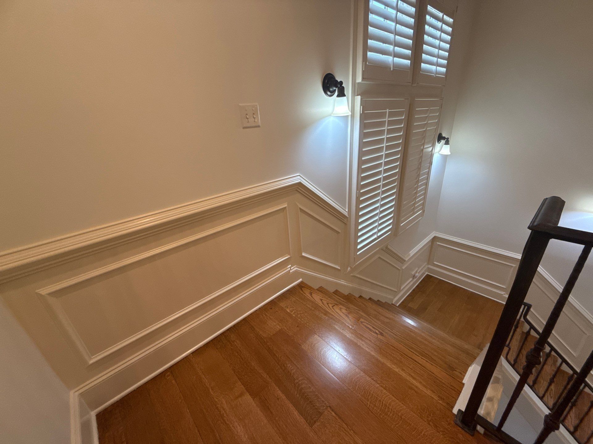 Painted walls and trim white in 2 story house in waukee, iowa. 