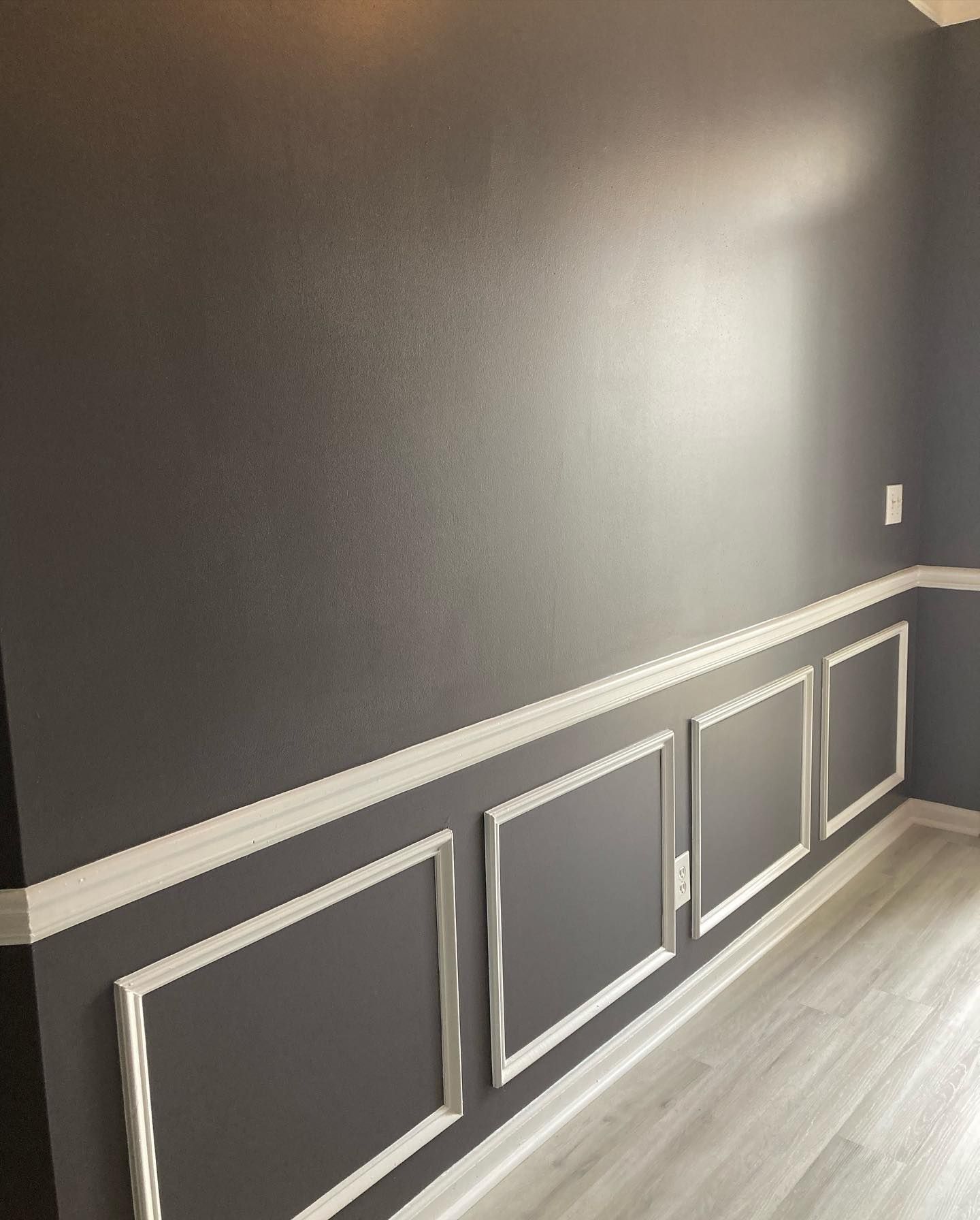Interior wall painted brown with white trim in Urbandale, iowa. 