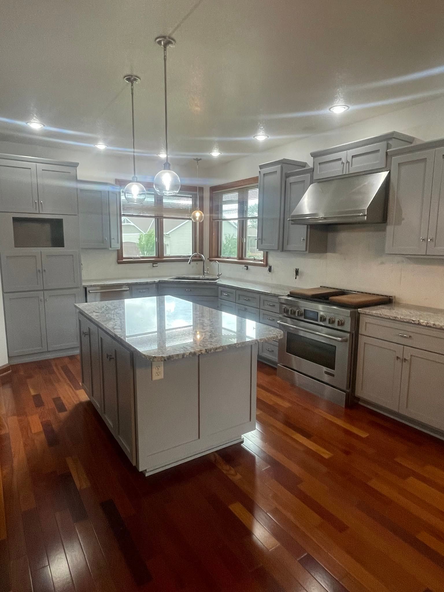Painted walls white and cabinets gray in Ankeny, Iowa.