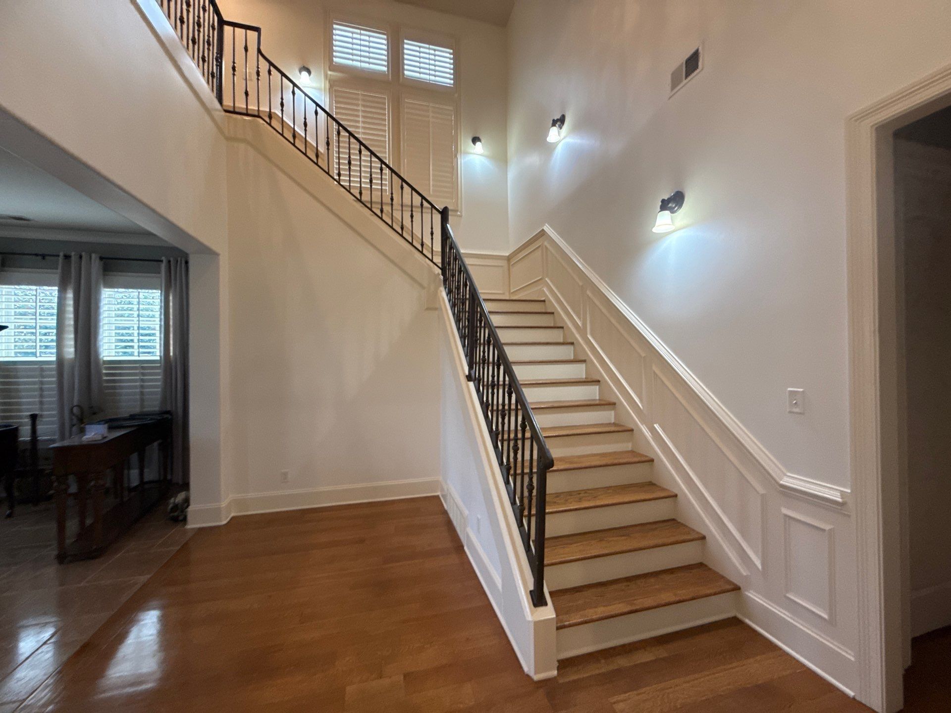 Painted walls and stairwell white in 2 story house in Waukee, Iowa. 