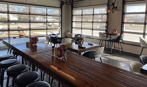 bar area with patio and screened in garage doors