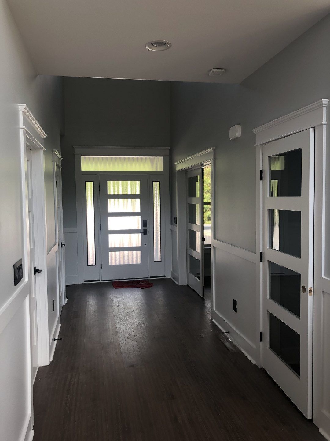 A hallway with a door in the middle of it