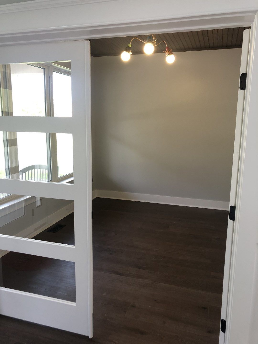 An empty room with a sliding glass door