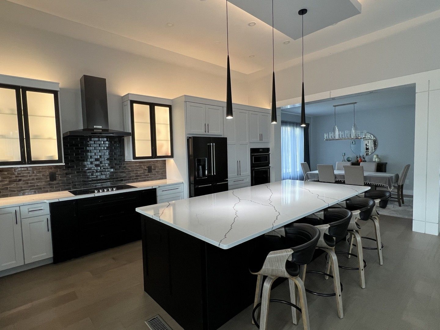 There is a large island in the middle of the kitchen.