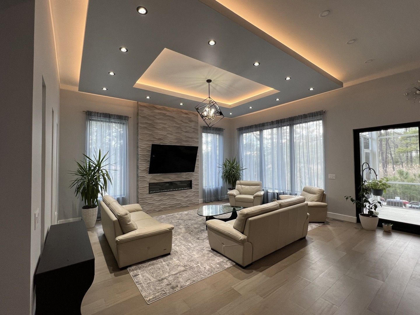 A living room filled with furniture and a flat screen tv.