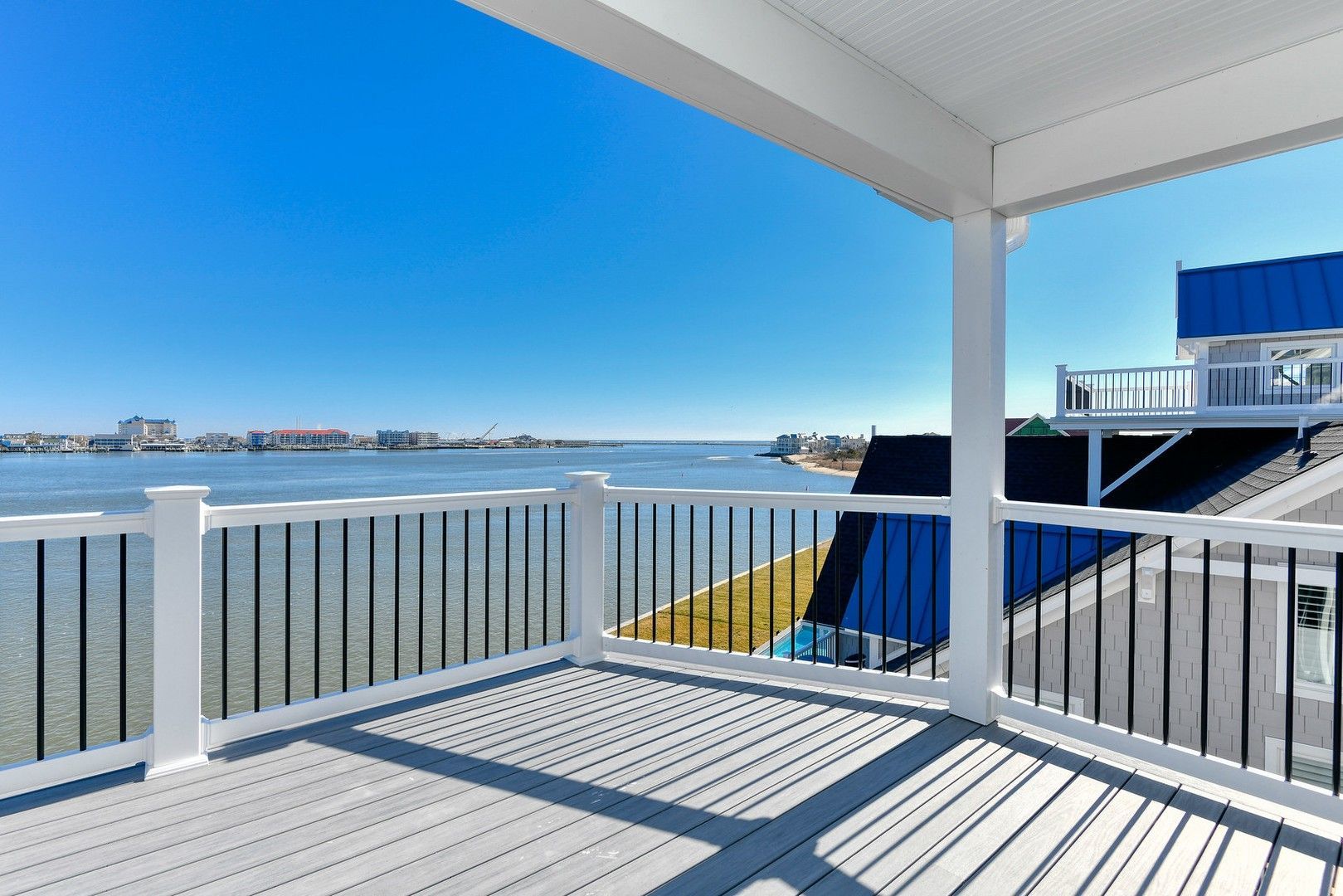 A balcony with a view of a body of water