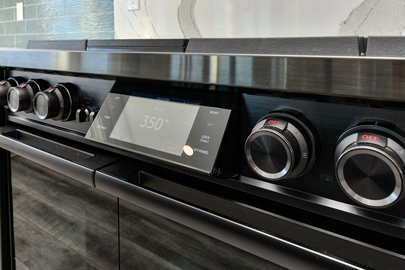 A close up of a stove top oven with a digital display.