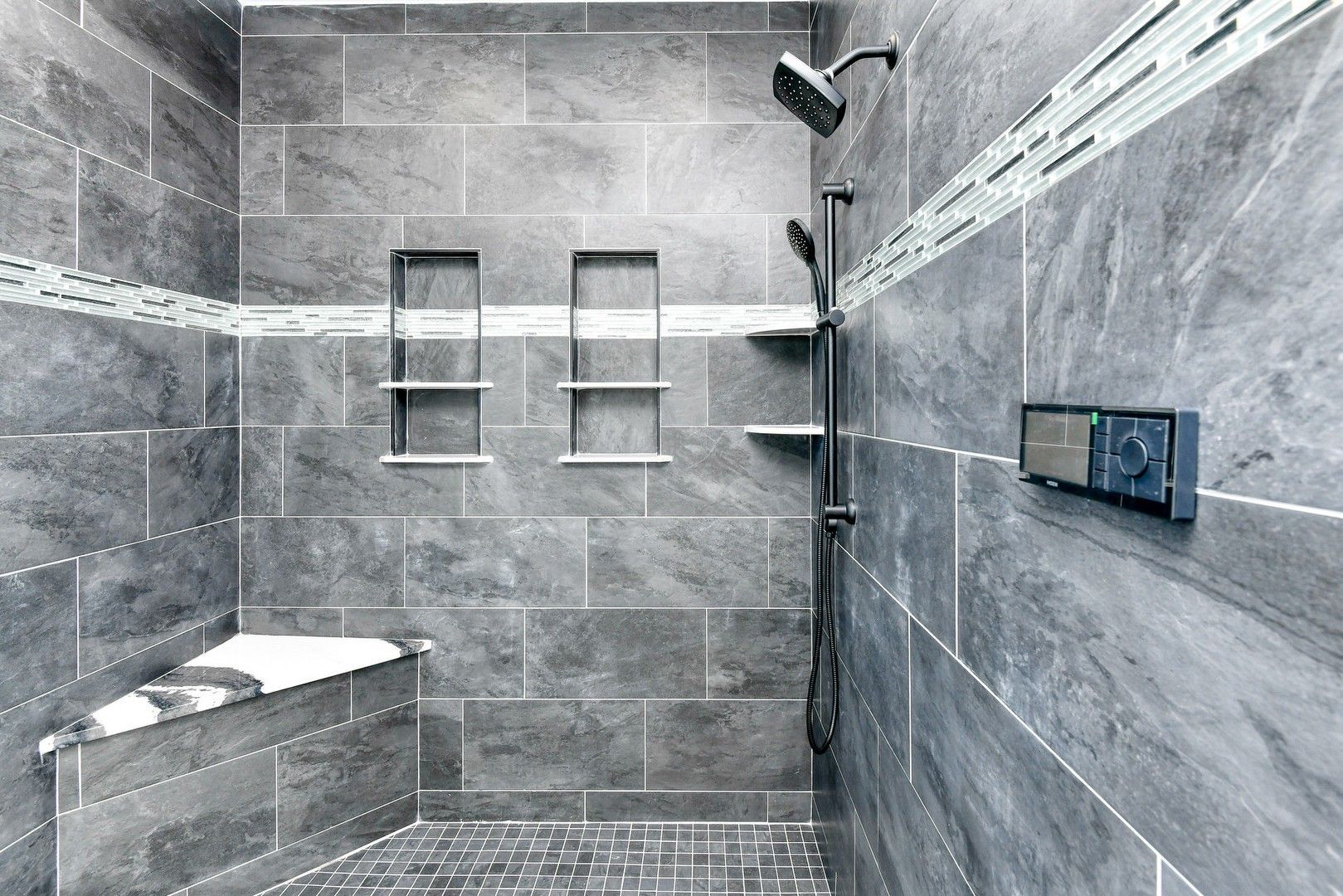 A bathroom with a walk in shower and a bathtub.