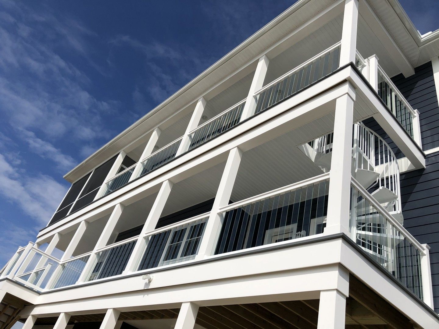 A large house with a lot of balconies and stairs