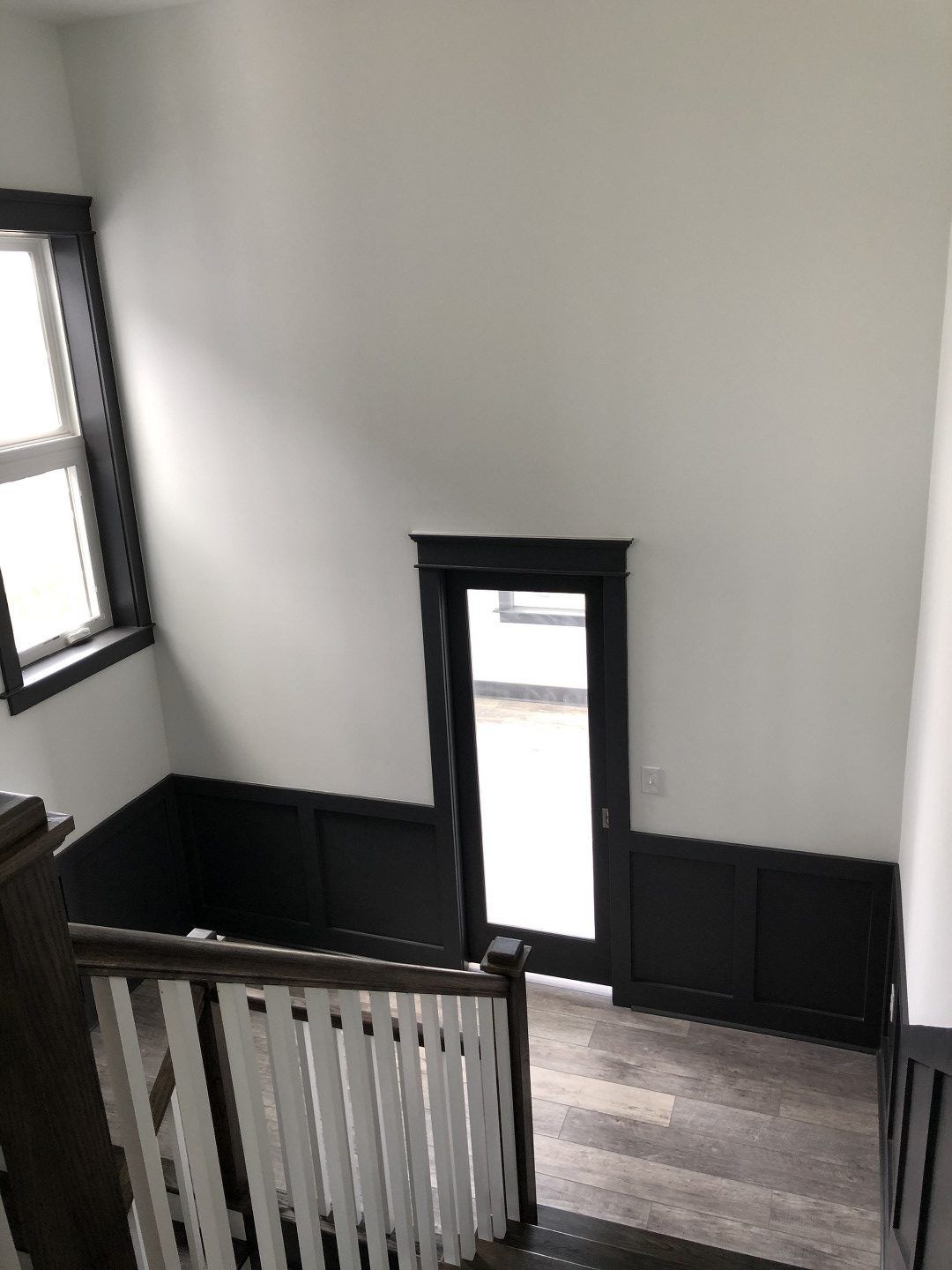 A view of a staircase from the second floor of a house.