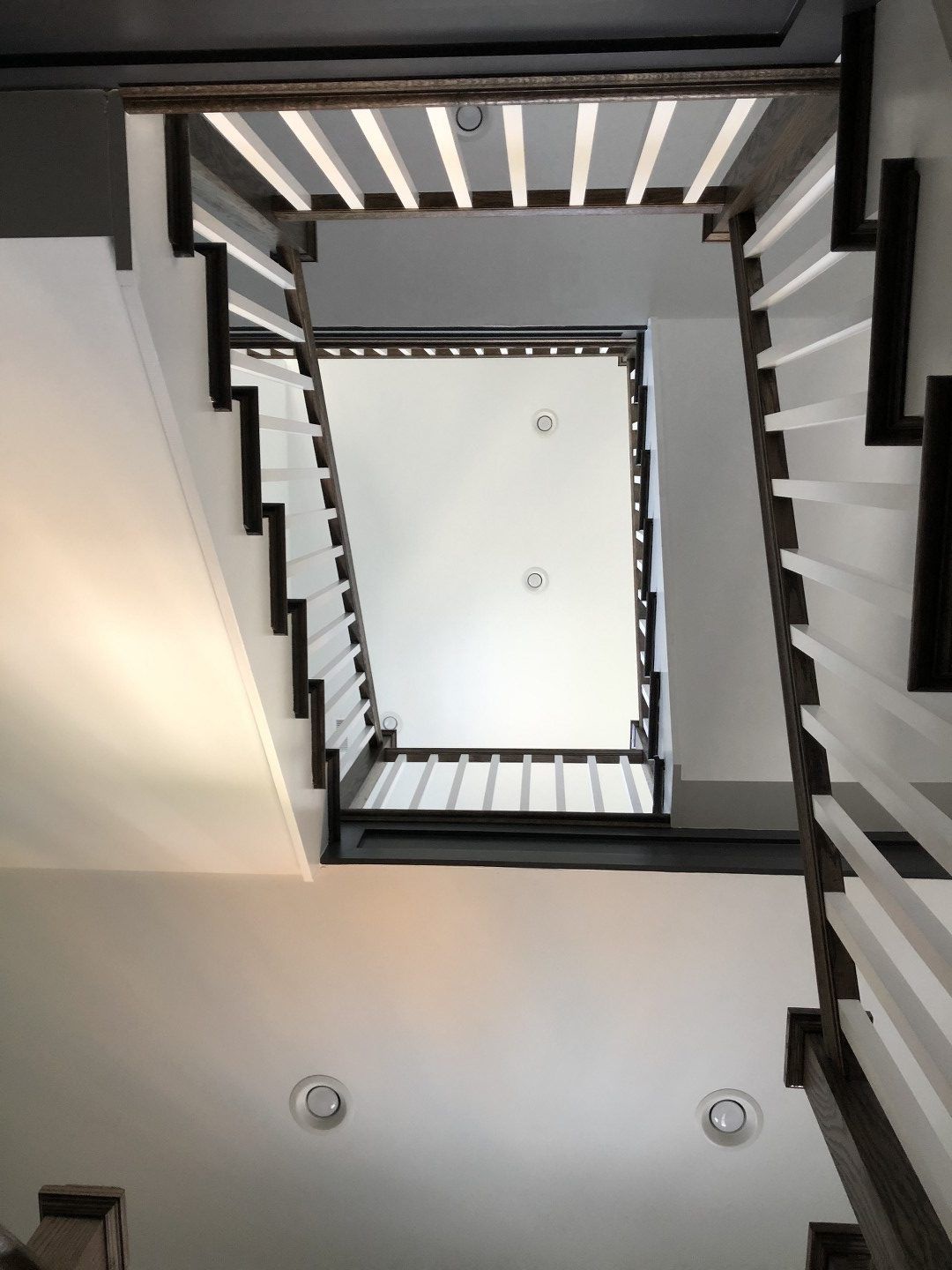 Looking up at the ceiling of a staircase