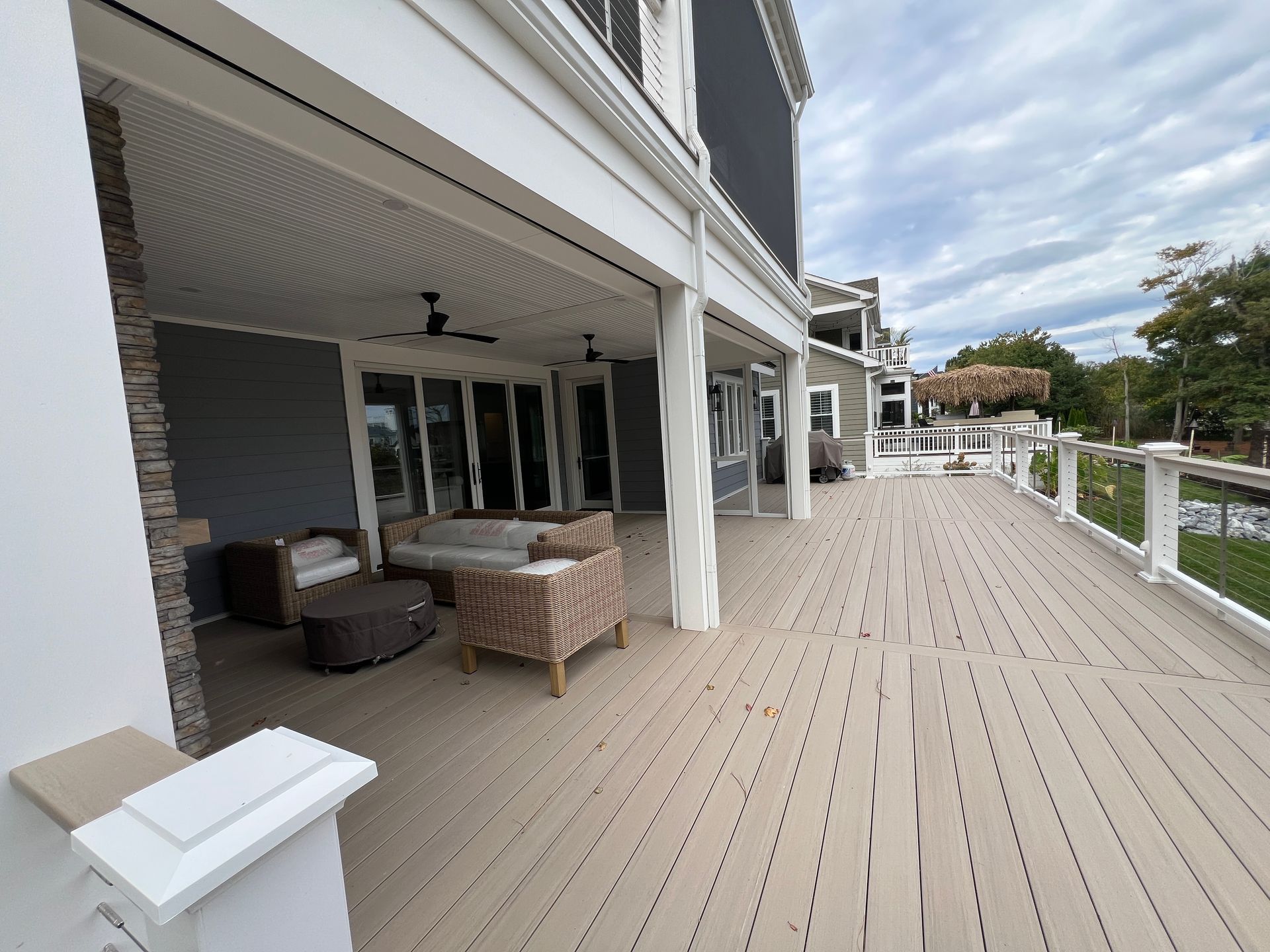 A large deck with a lot of furniture on it.