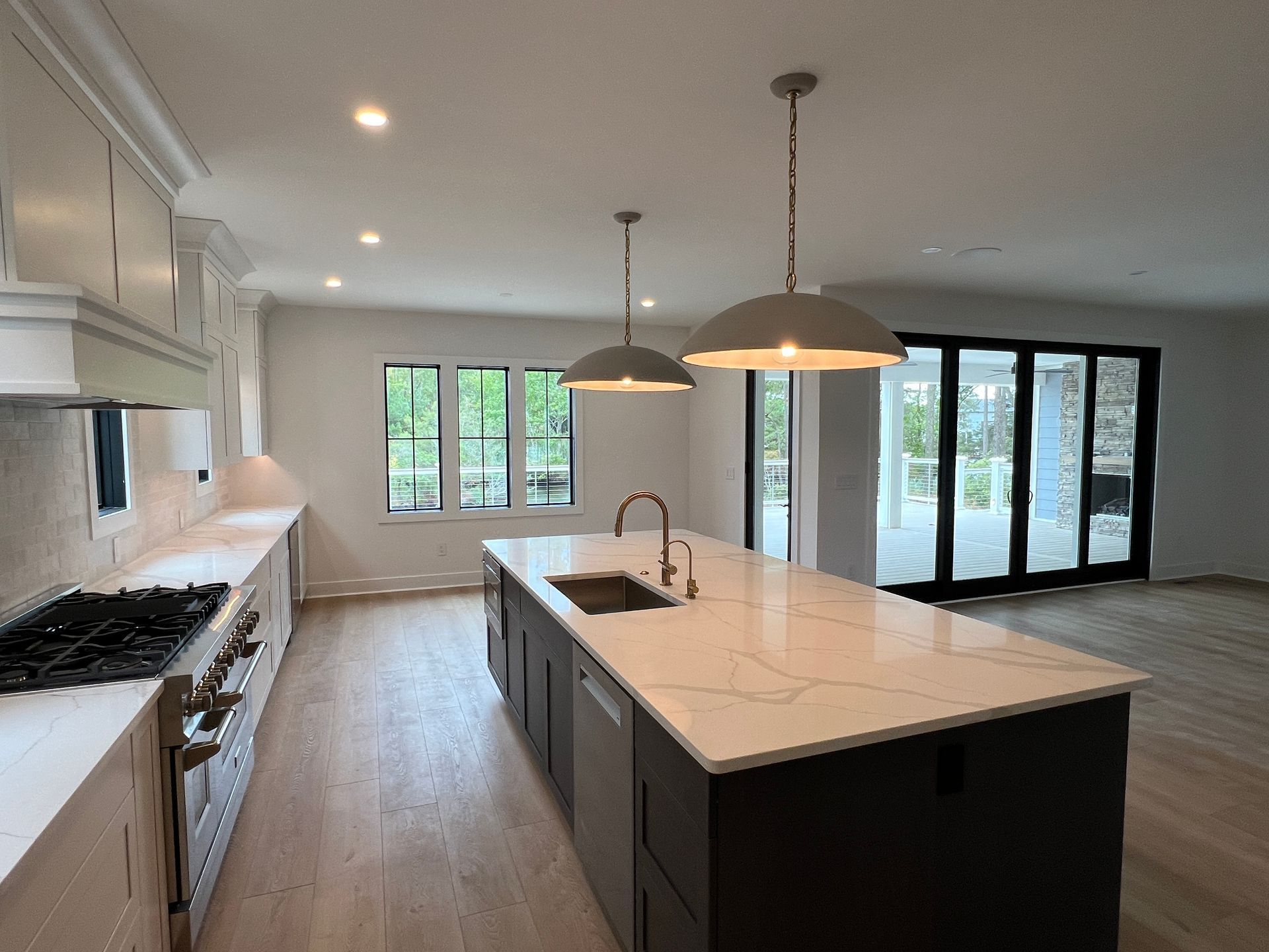 There is a large island in the middle of the kitchen.