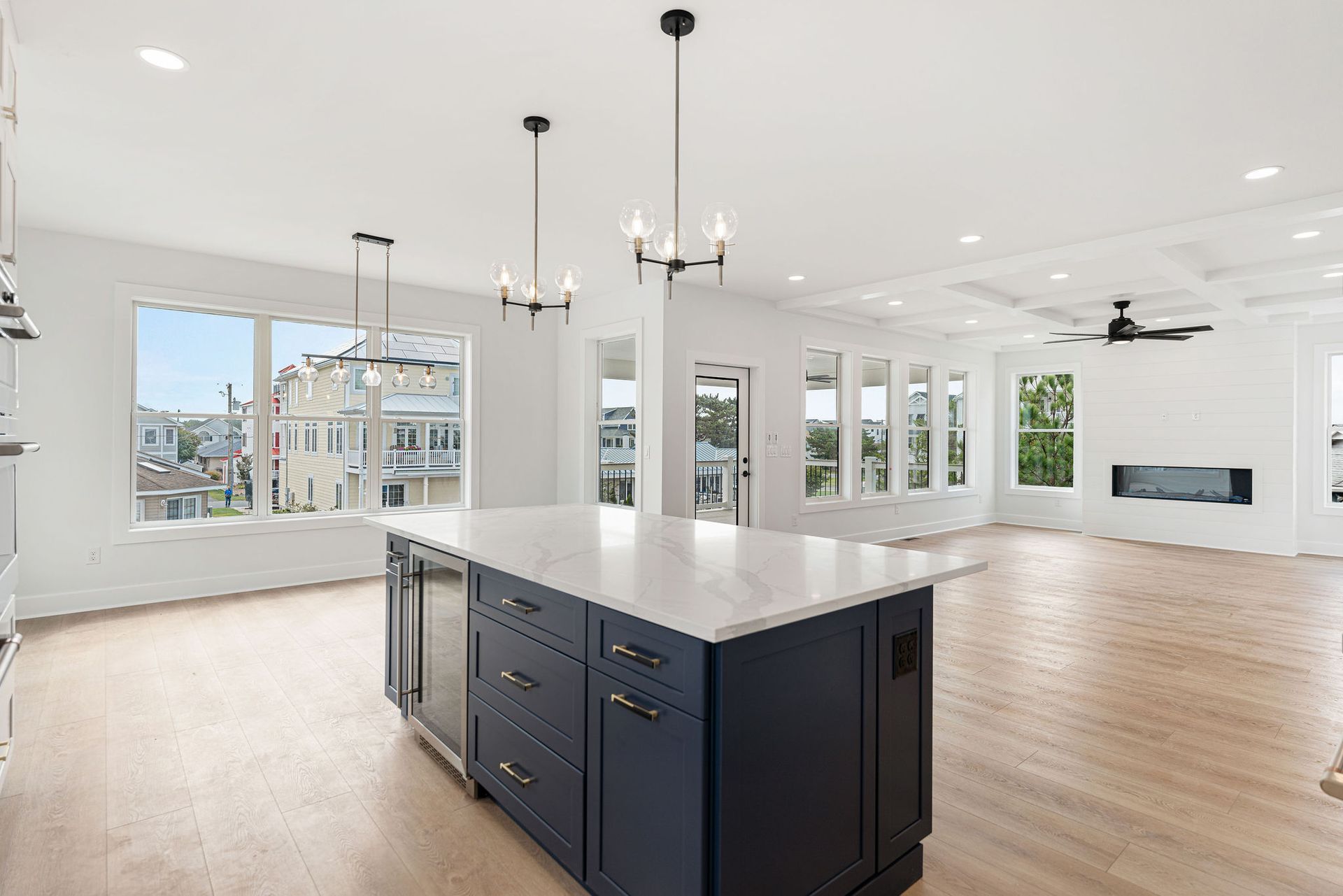There is a large island in the middle of the kitchen.
