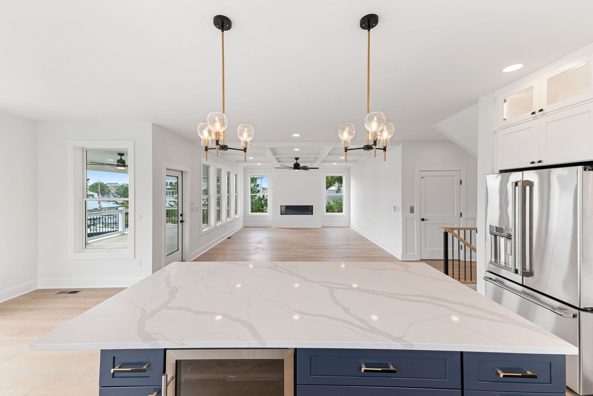 A kitchen with a large island and stainless steel appliances.