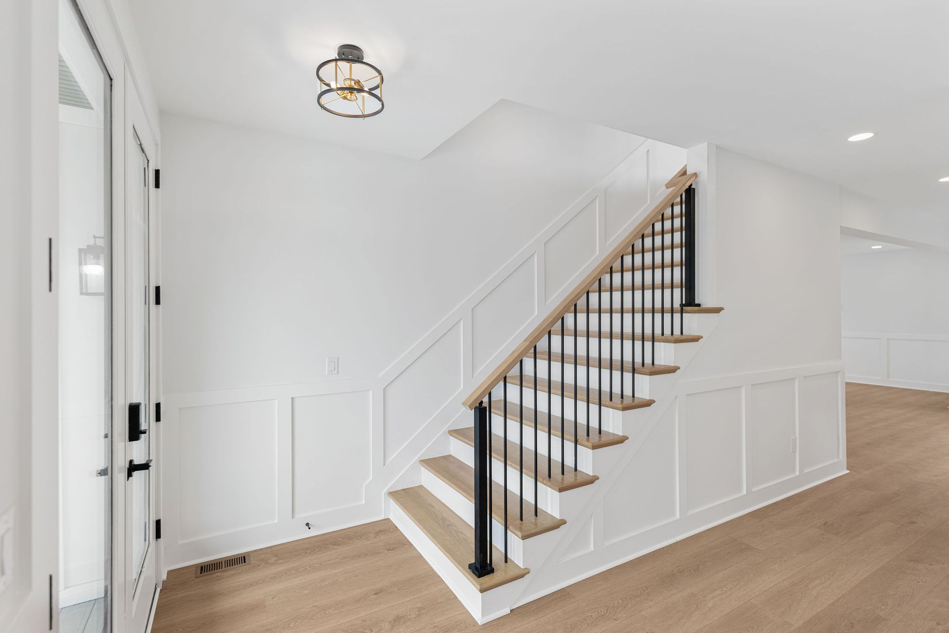 There is a staircase in the middle of the hallway.