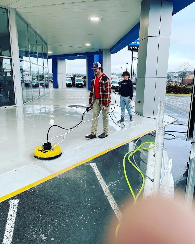 two men polishing commercial floor