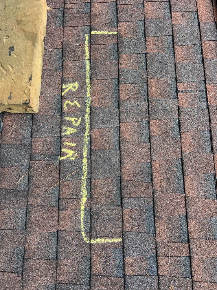 Roof shingles with a chalk outline labeled 