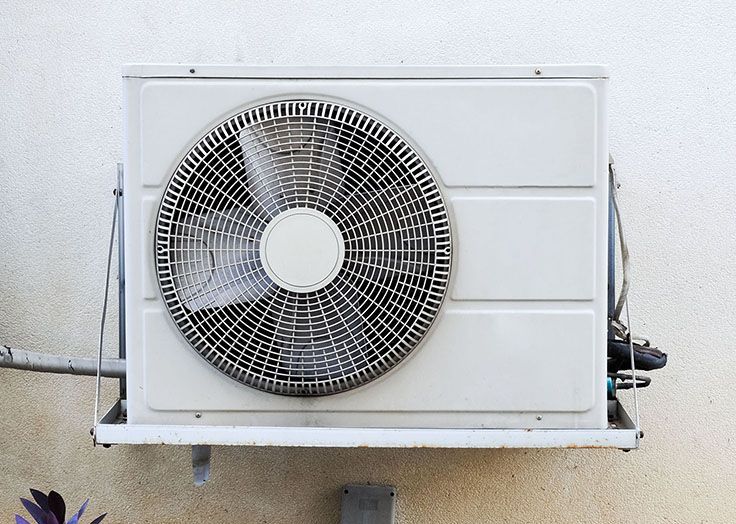 A white ductless mini split heat pump unit