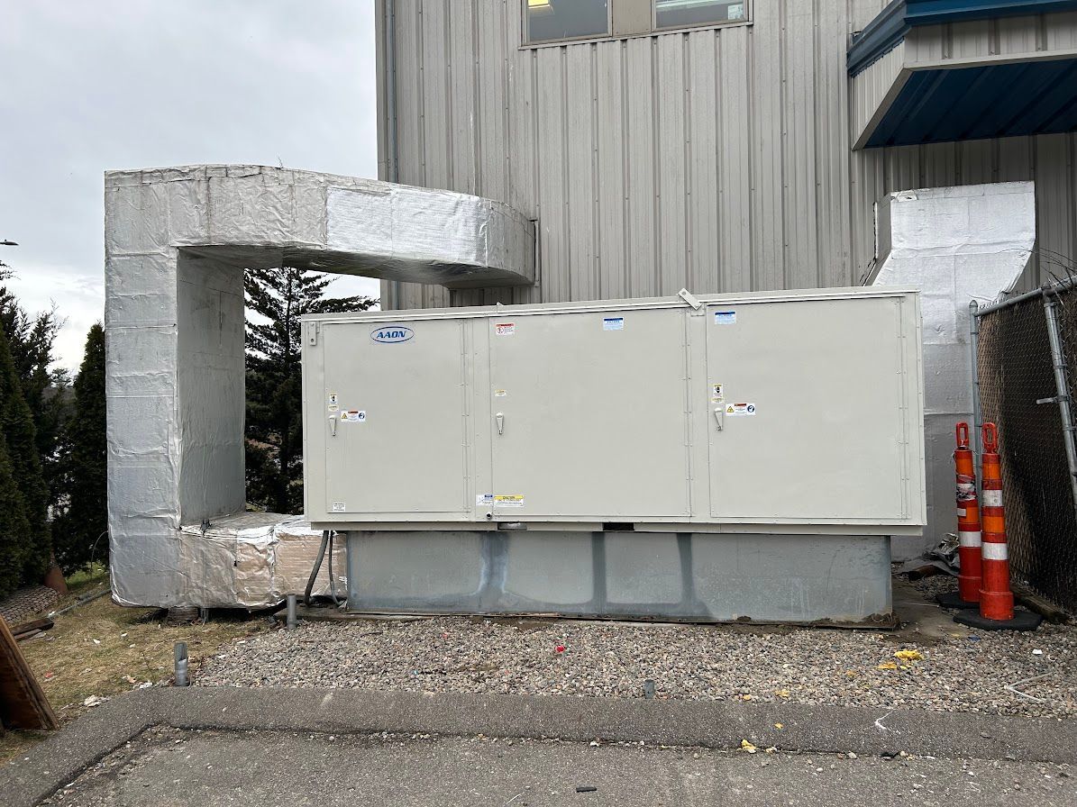 a large white box is sitting in front of a building