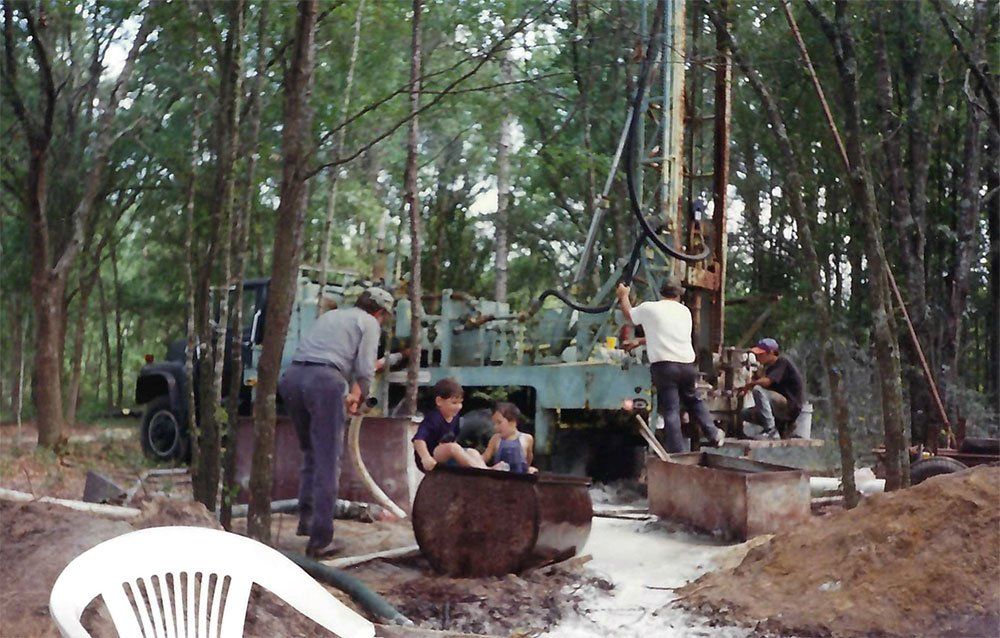 Three men doing pump service