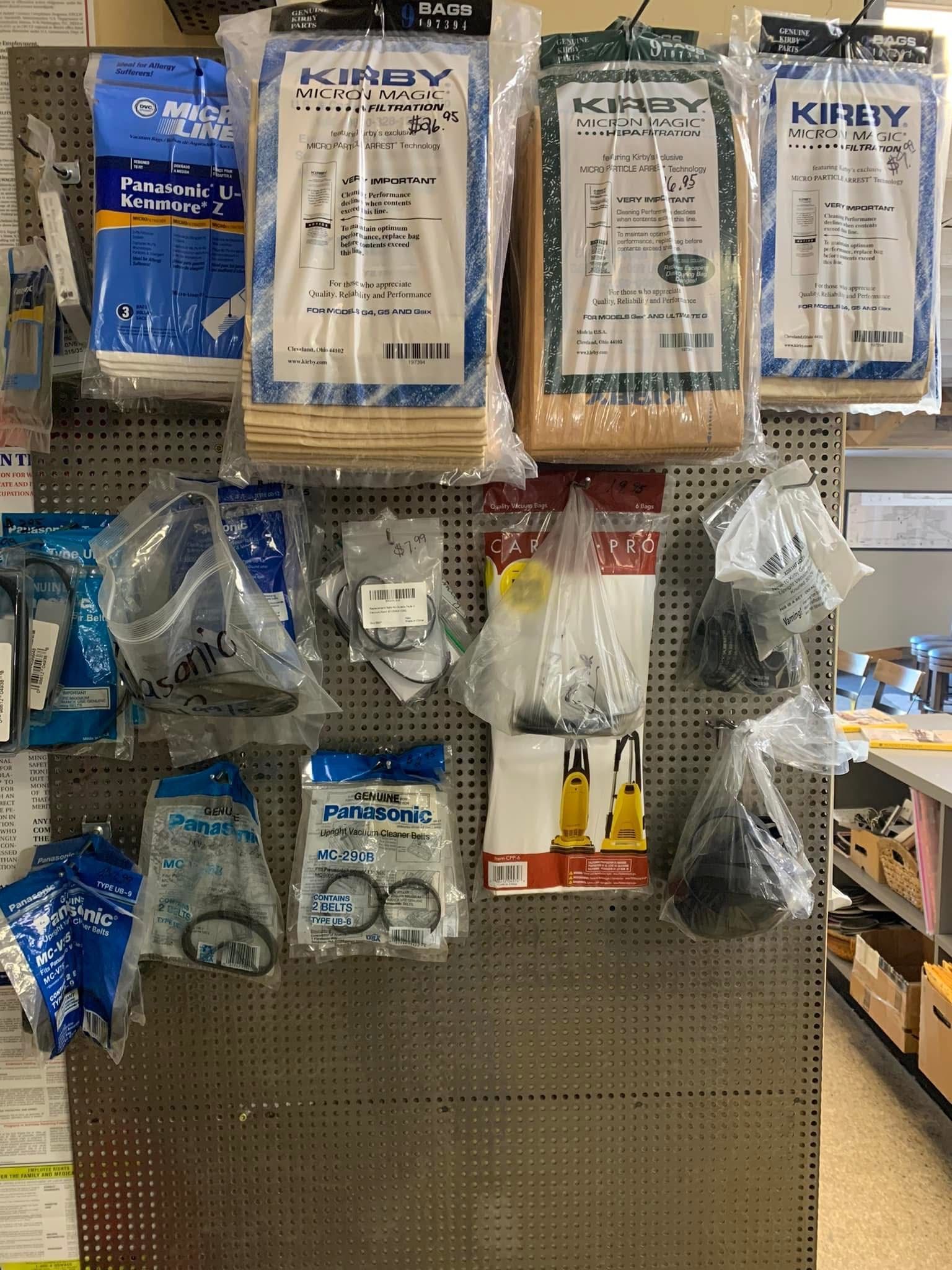 Hardware store display of bagged Kirby vacuum parts.