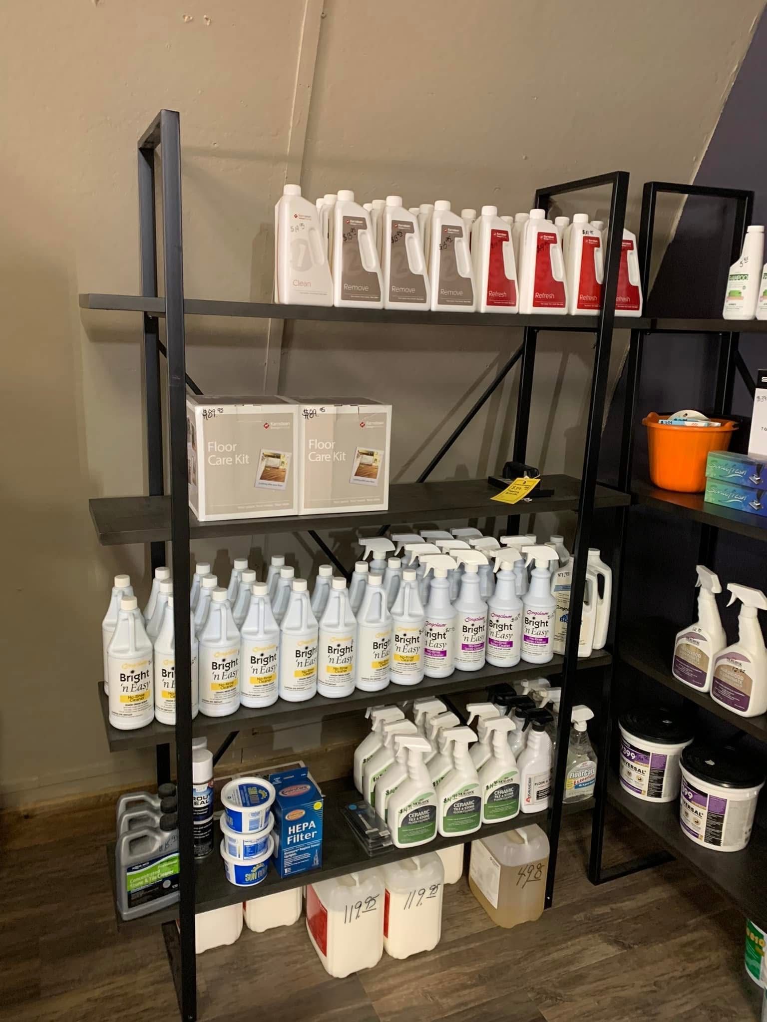 Metal shelves filled with cleaning supplies, various brands and colors.
