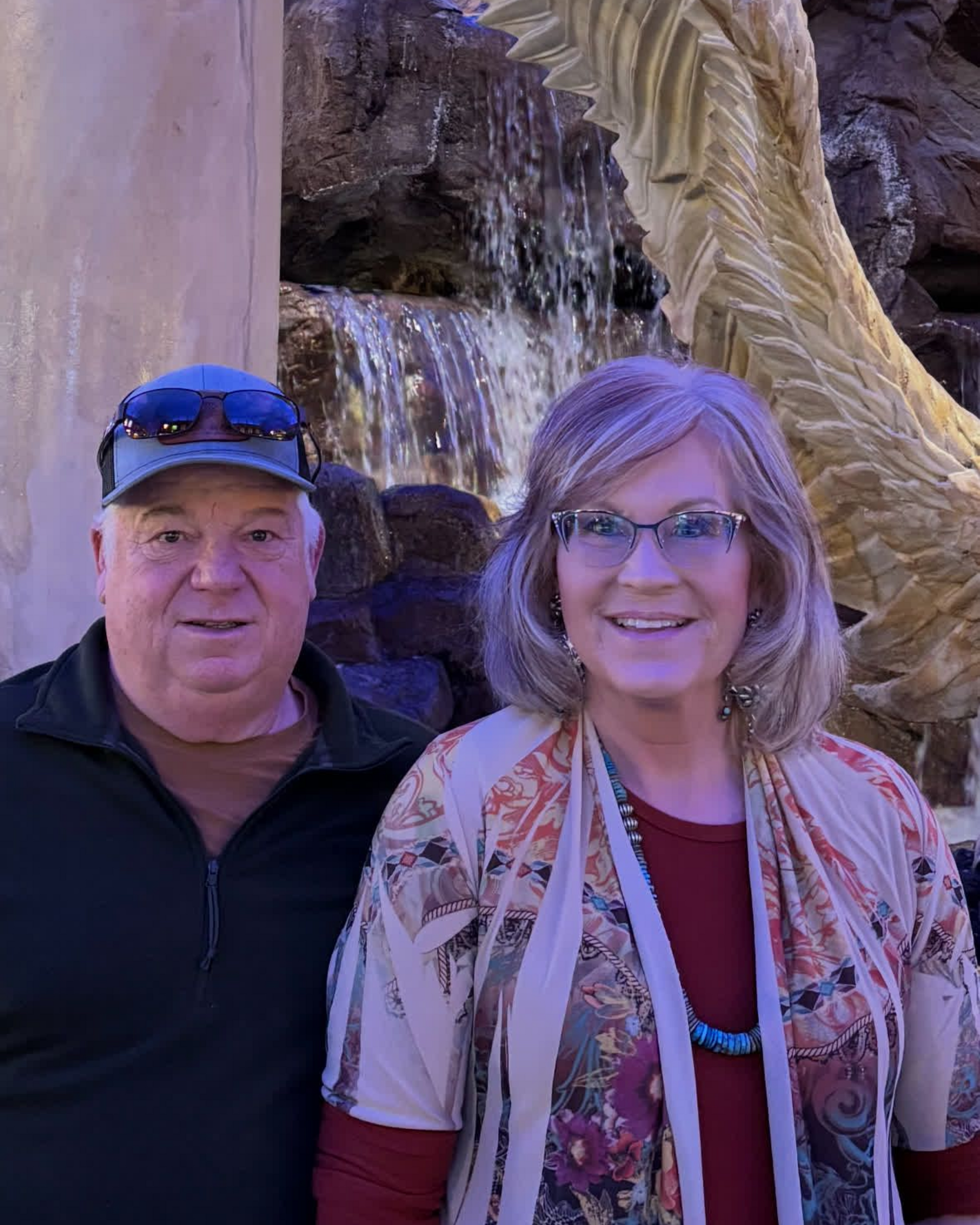 Silhouette of a person in a suit, gray background.