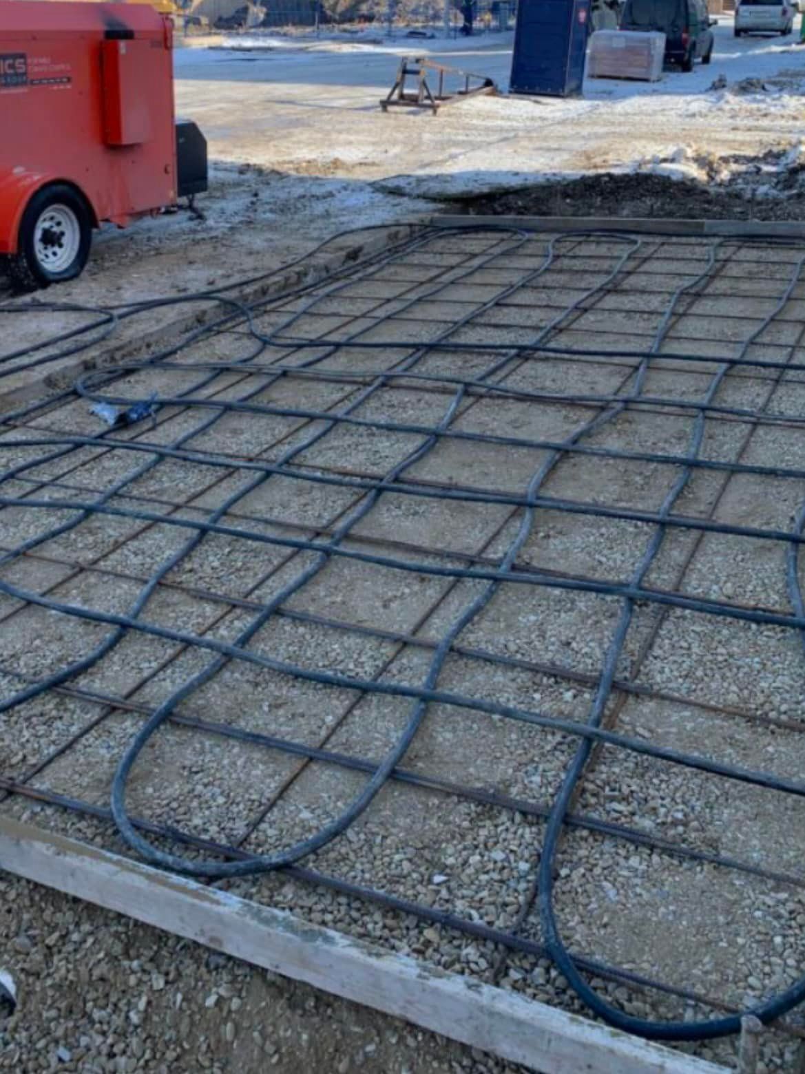 A concrete floor with a lot of wires on it