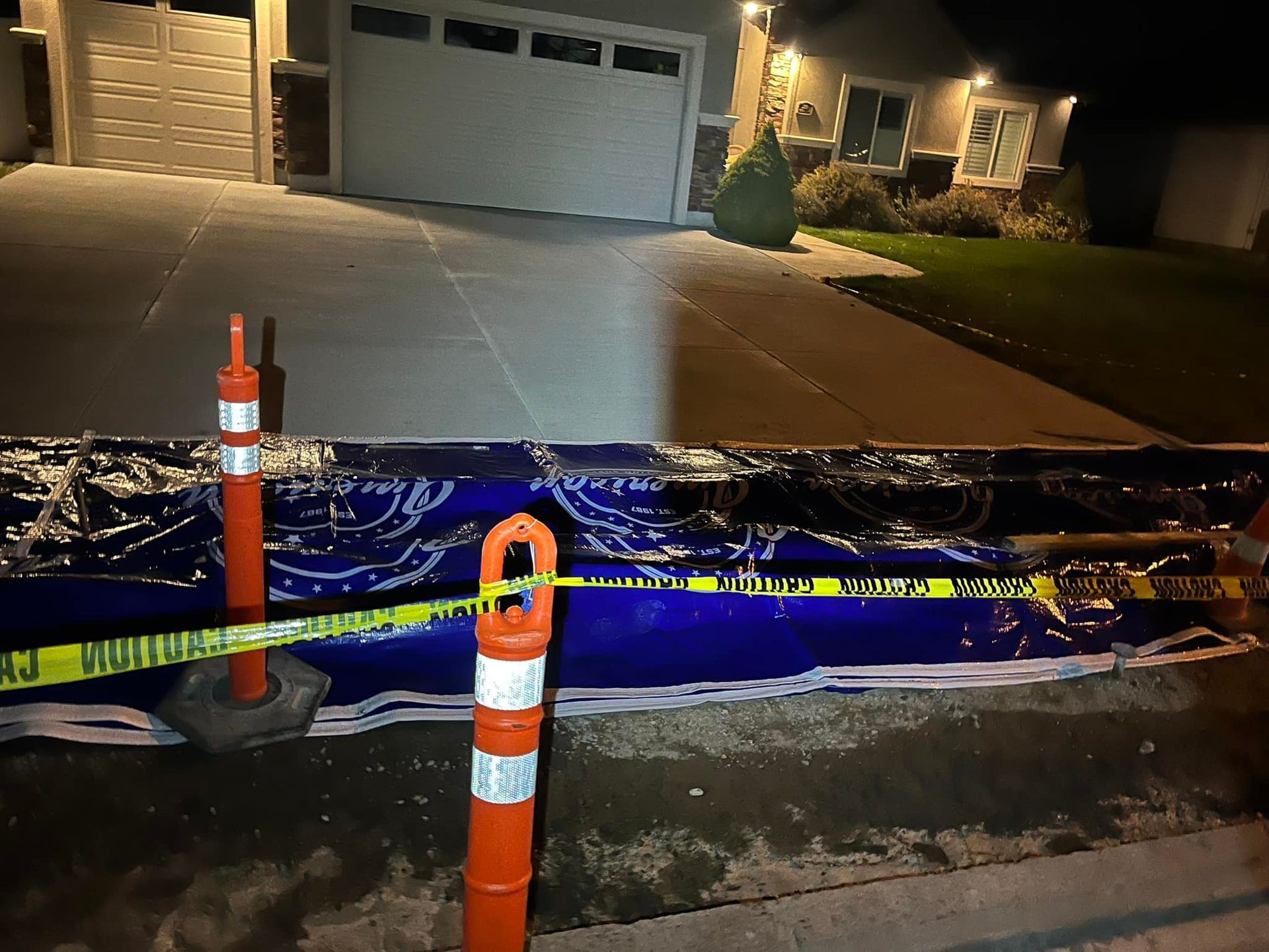 A house with a blue tarp on the side of it