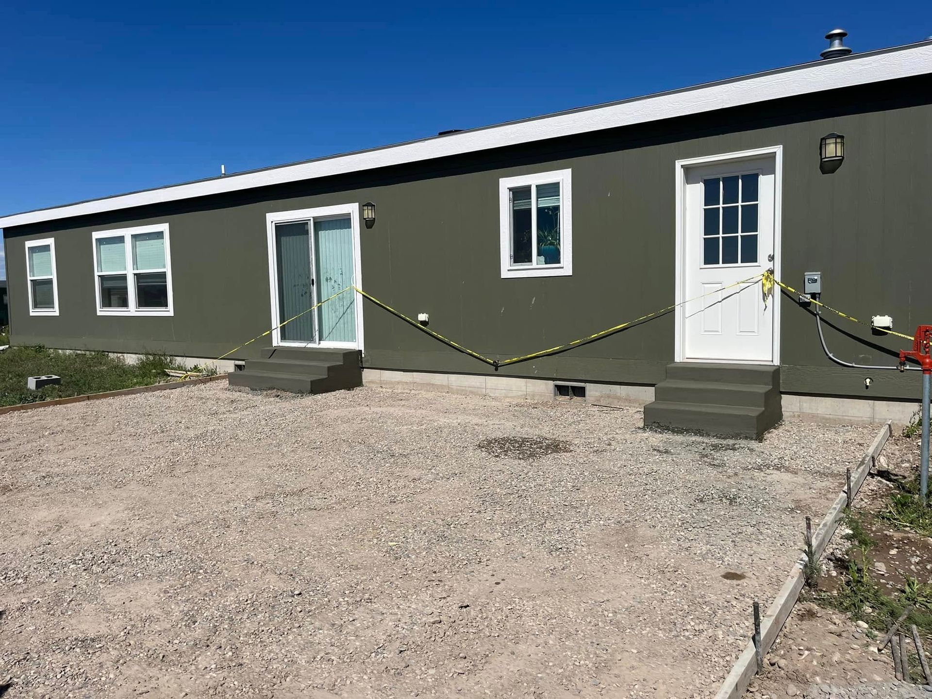 A house with a lot of windows and a white door