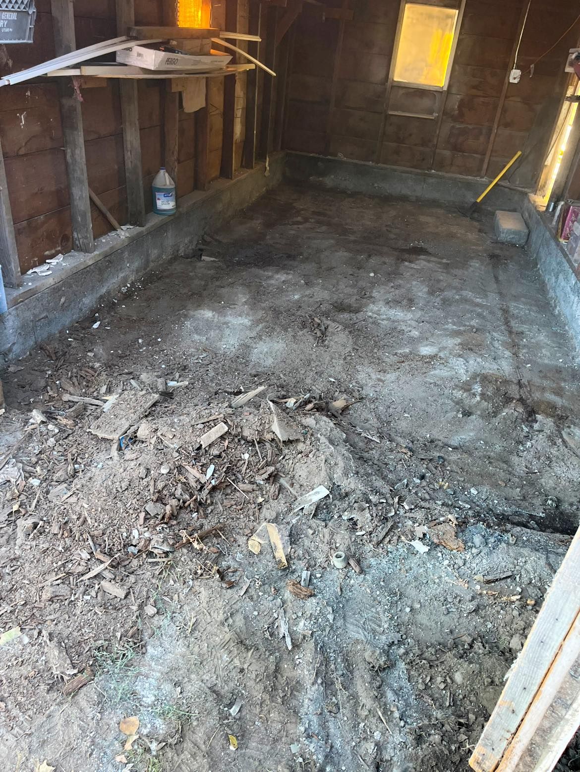 A dirty room with a lot of dirt on the floor