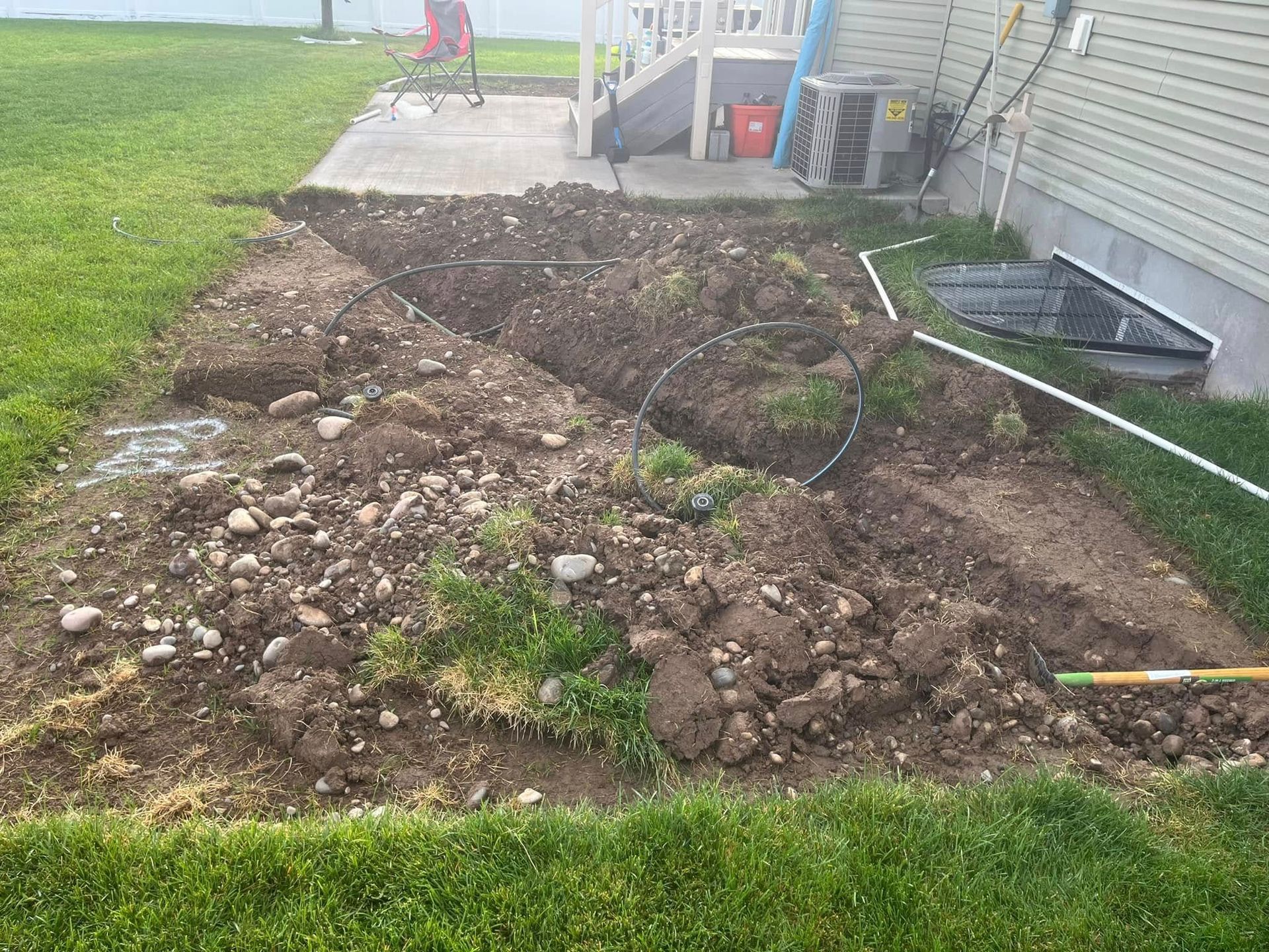 There is a lot of dirt in the backyard of a house
