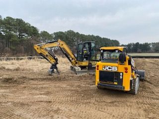 two trucks for grading services