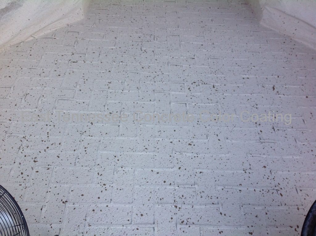 A concrete floor with stencil design application