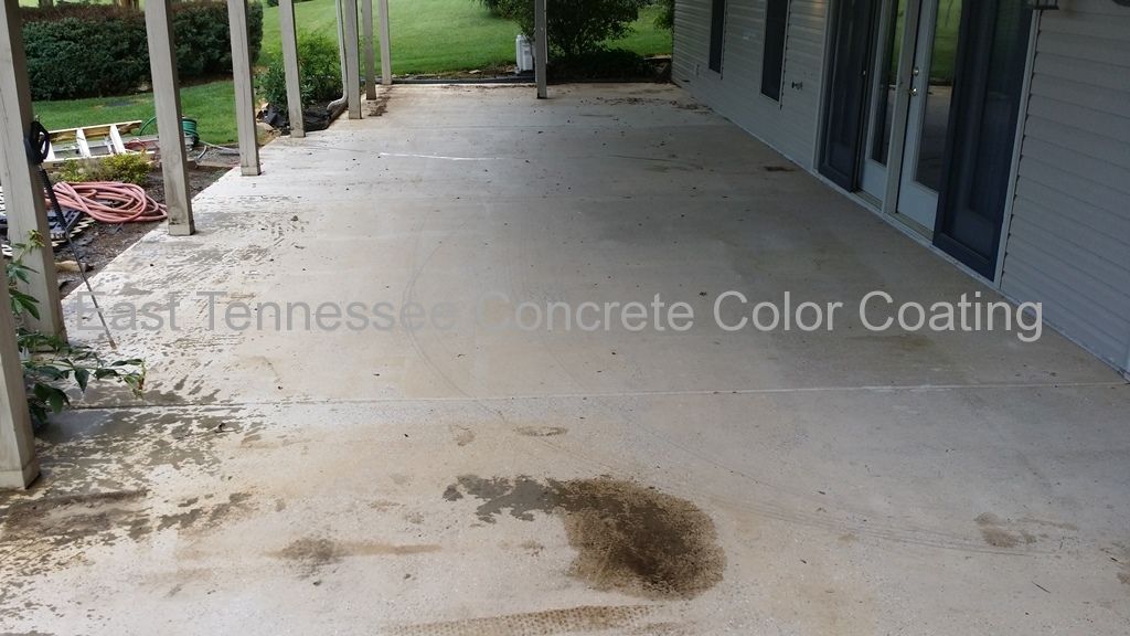 A concrete patio with a stain