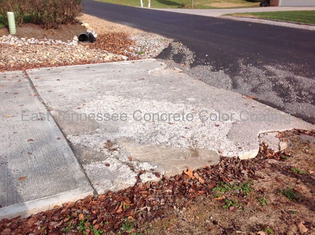 A concrete sidewalk is sitting on the side of the road