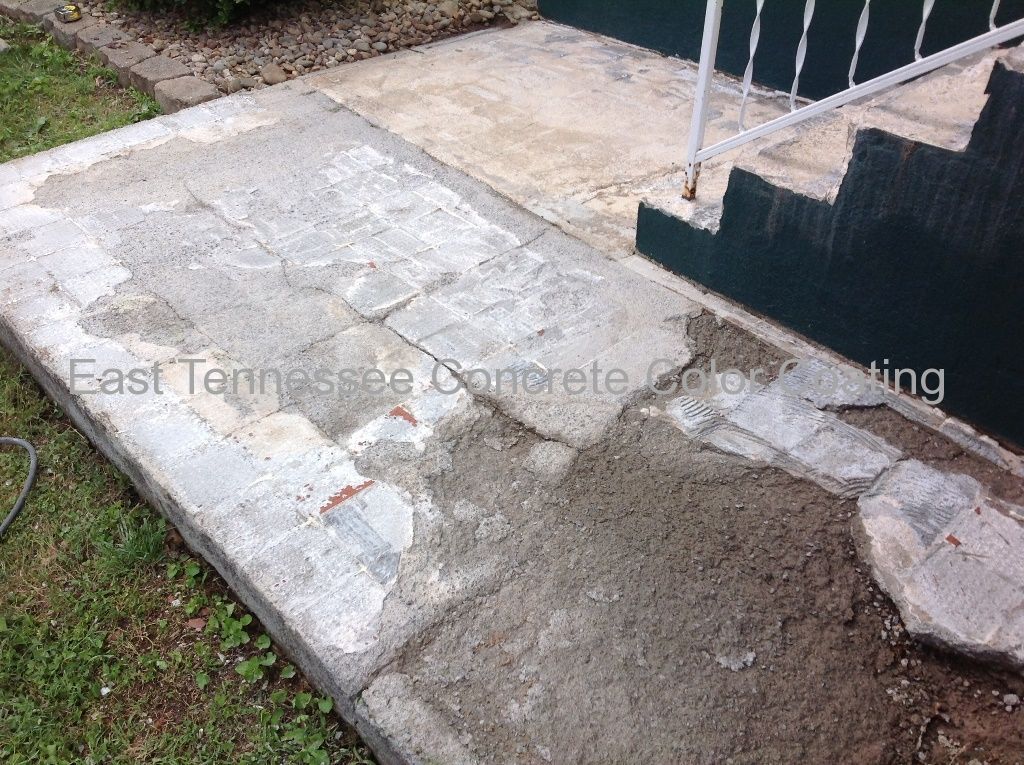 A sidewalk is being built in front of a house.