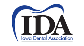 Logo of the Iowa Dental Association: blue tooth outline over dark text 