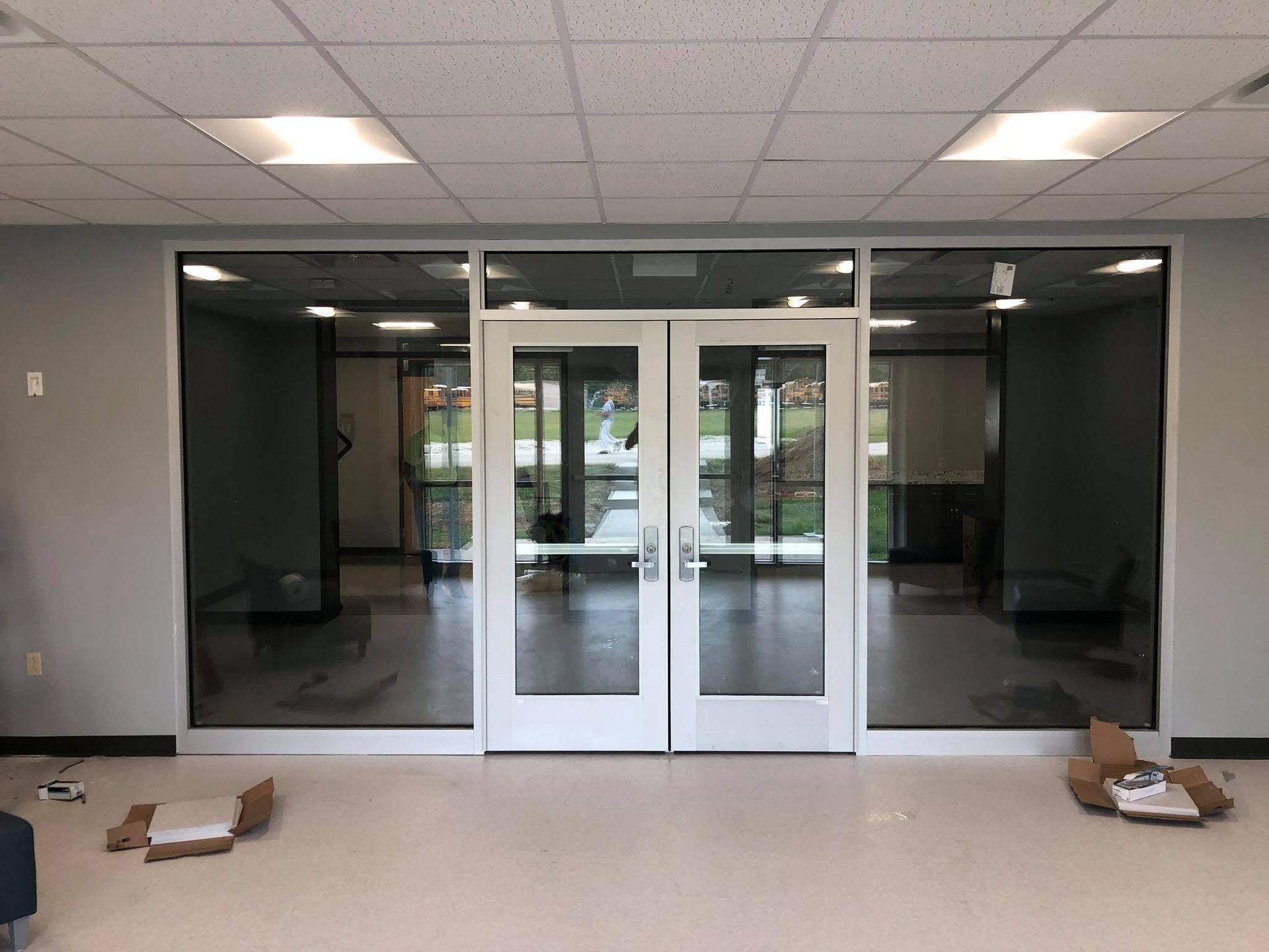A large room with a lot of windows and doors.