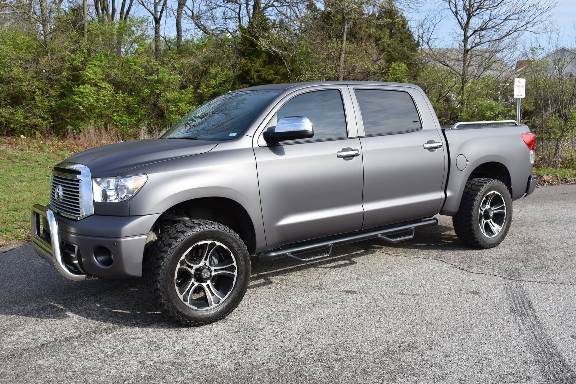 A toyota tundra is parked on the side of the road.