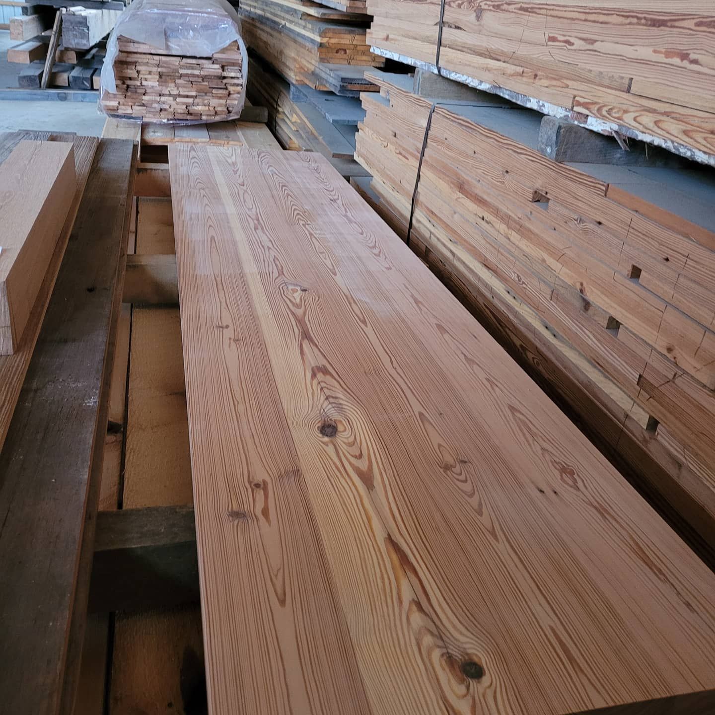A bunch of wooden boards are stacked on top of each other
