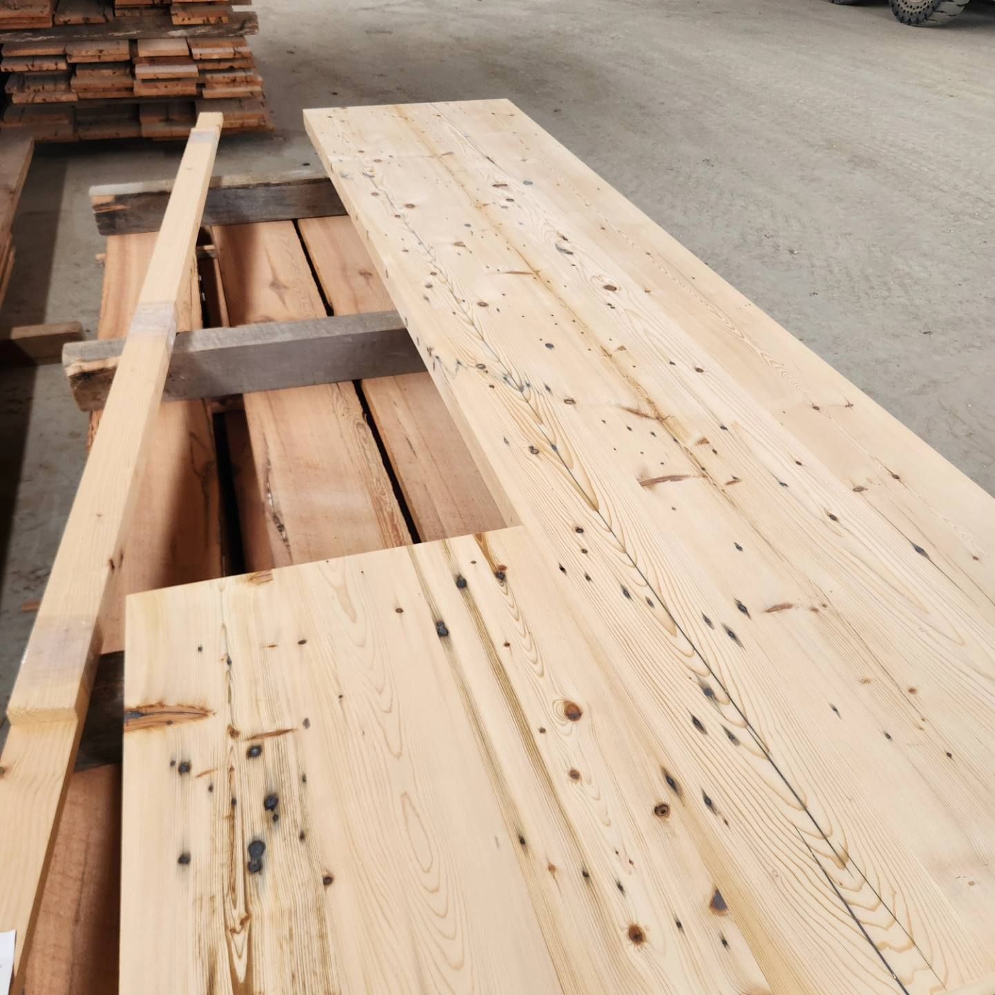 A large piece of wood is sitting on the ground