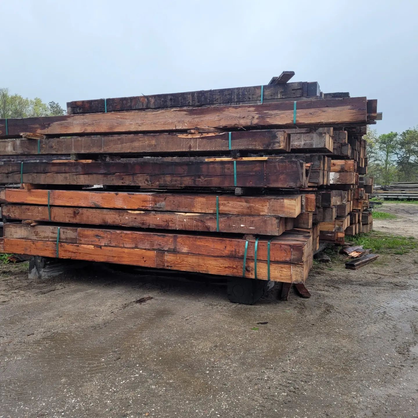A pile of wooden beams stacked on top of each other