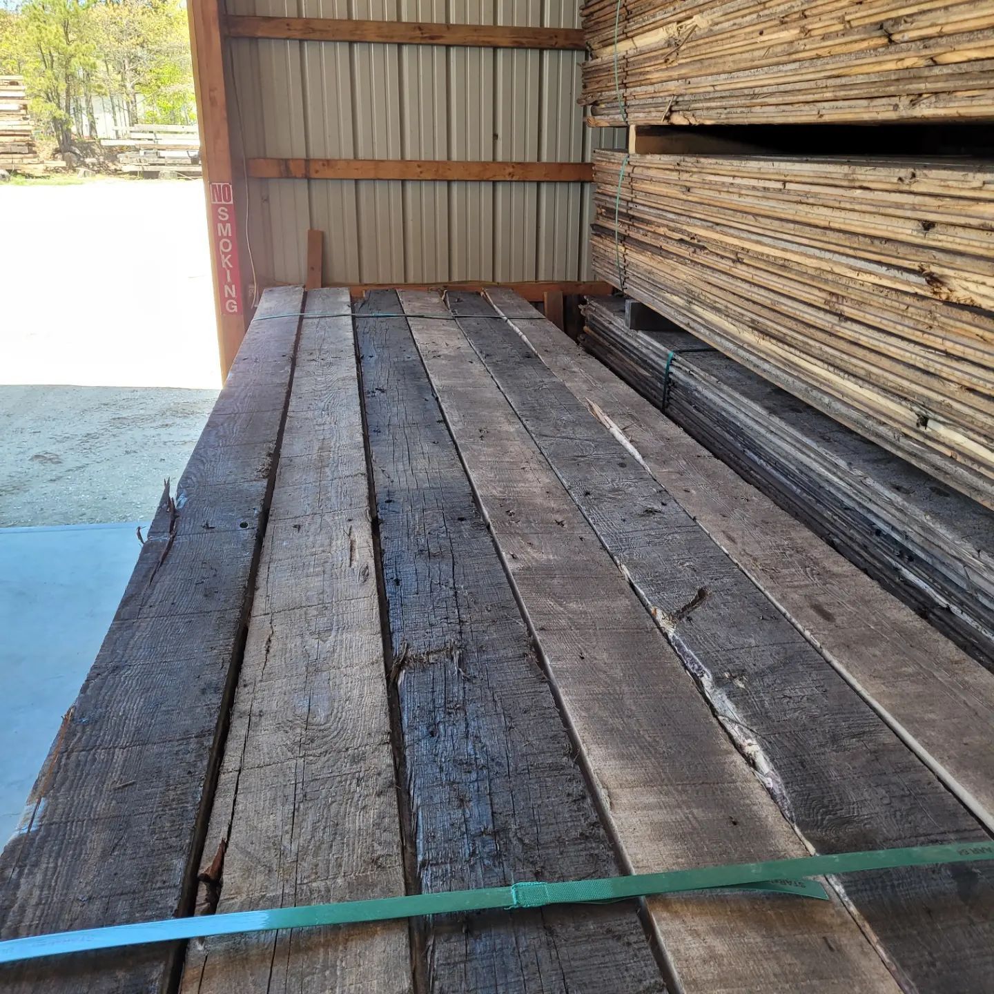 A warehouse filled with lots of wooden boards