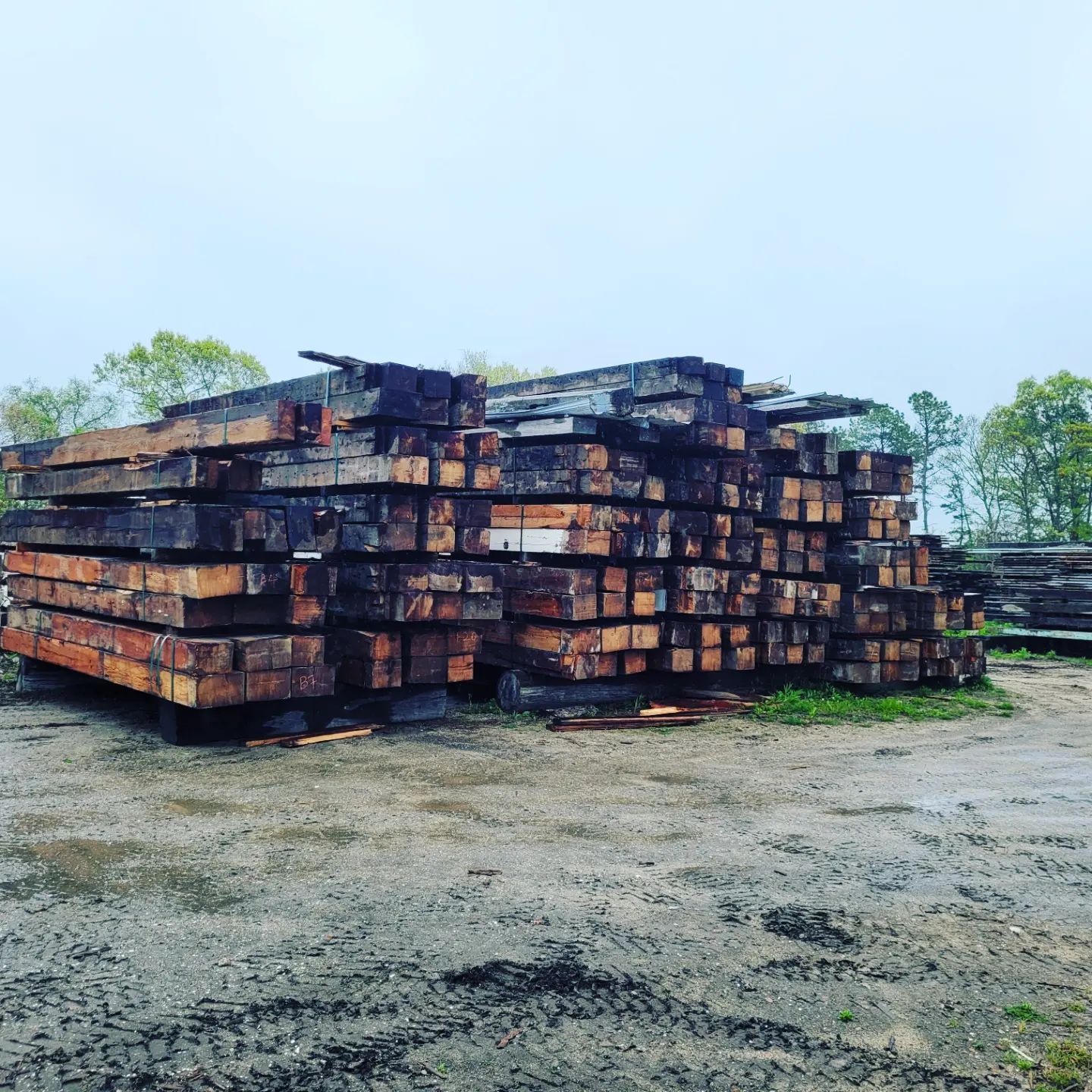 A pile of wooden beams stacked on top of each other