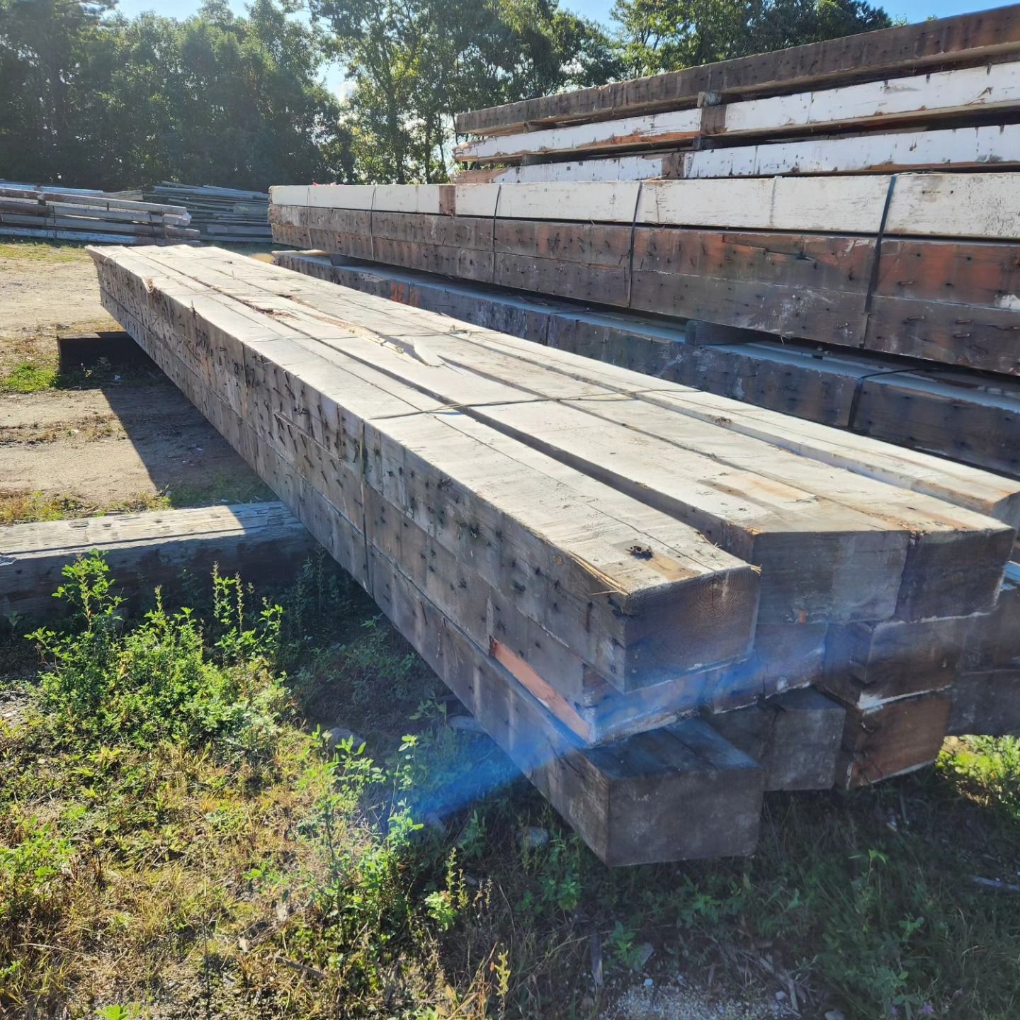 A bunch of wooden beams are stacked on top of each other