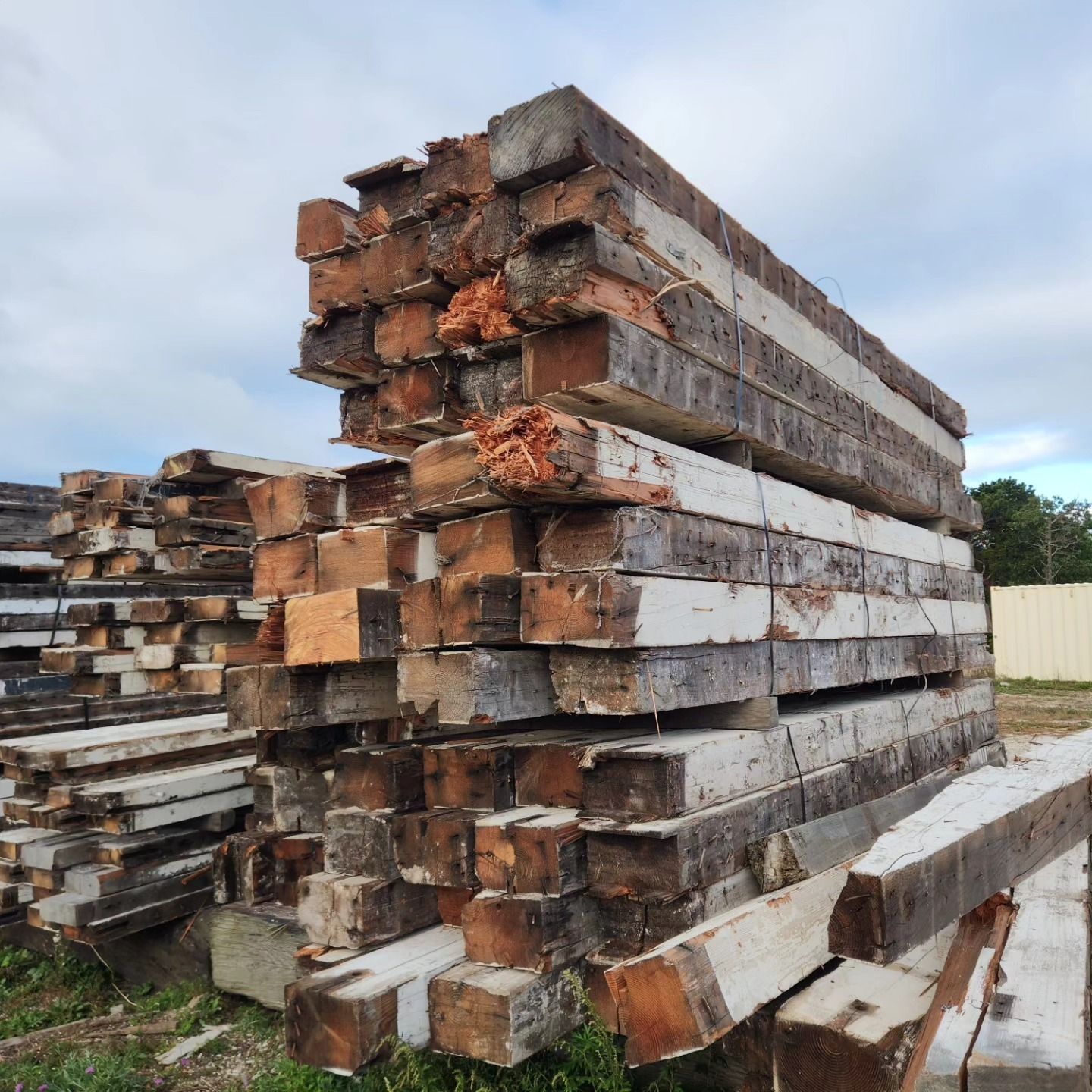 A pile of wooden beams stacked on top of each other