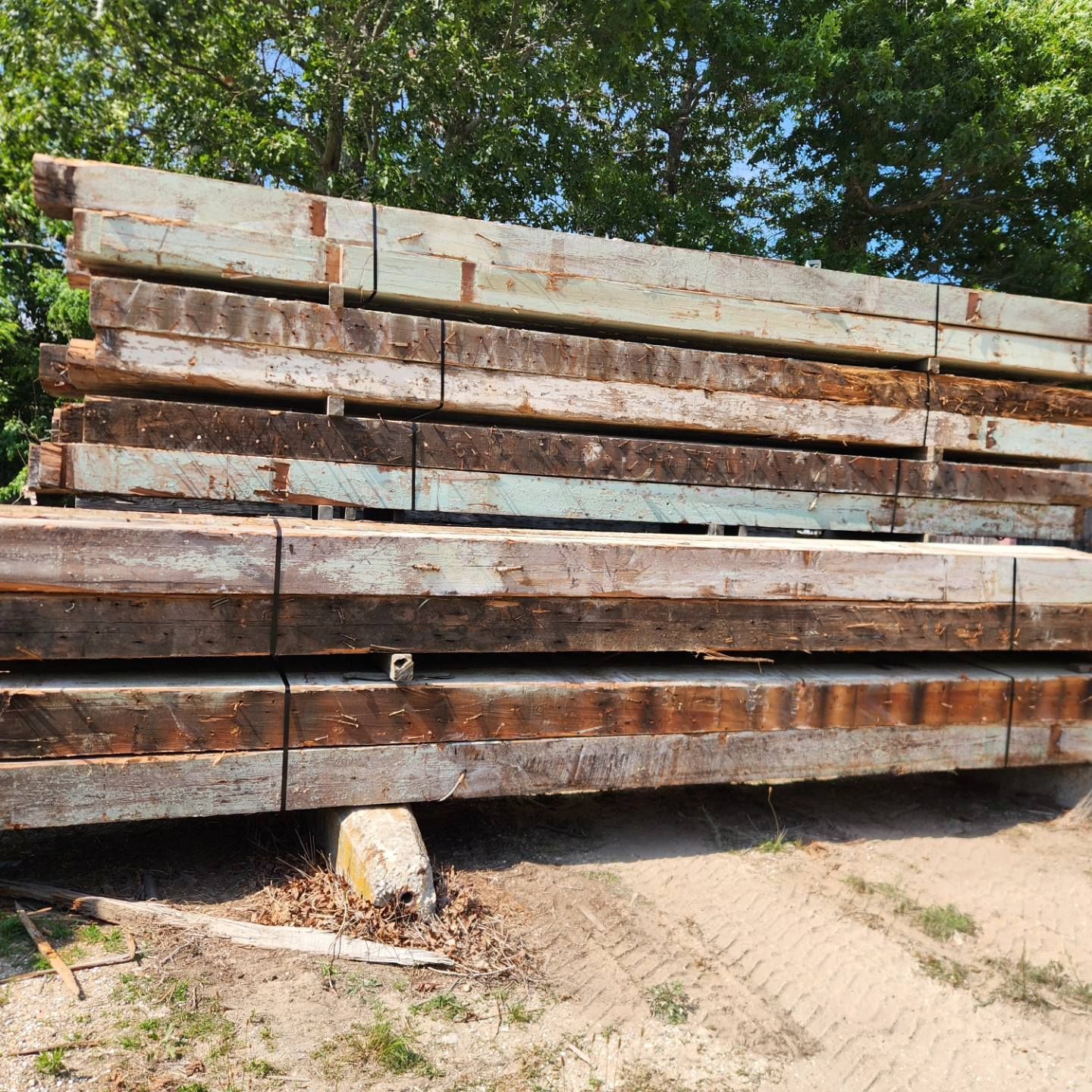 A pile of wooden beams stacked on top of each other