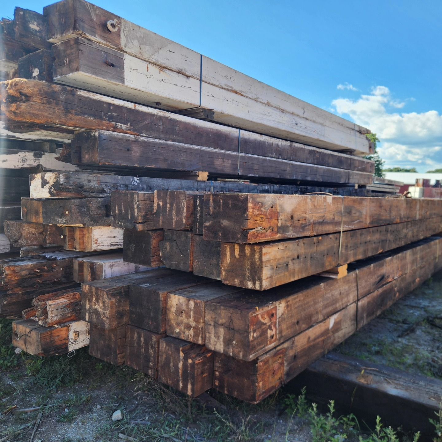 A pile of wooden beams stacked on top of each other